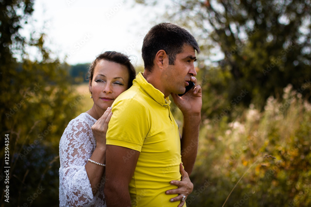 Beautiful couple outdoors in a summer day Beautiful couple outdoors in a summer day