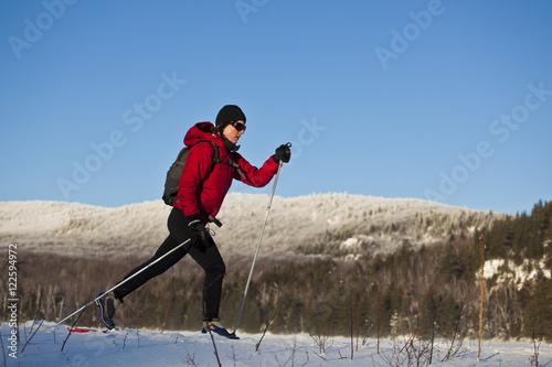 A woman crosscountry skiing at Mt Orford, Quebec, Canada photo