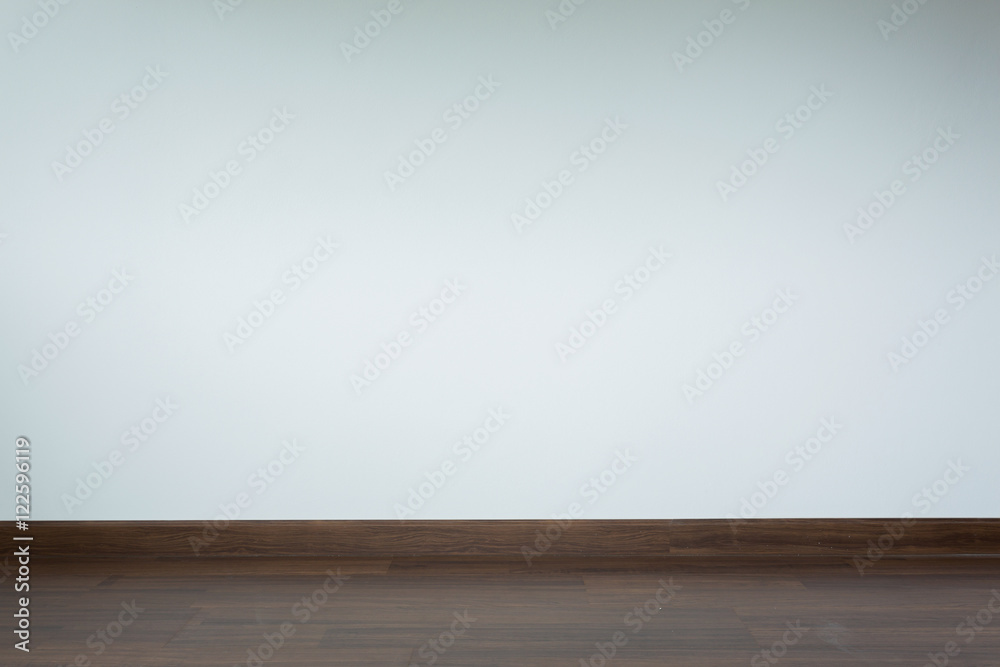 empty room interior, brown wood laminate floor and white mortar empty room interior, brown wood laminate floor and white mortar