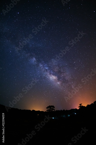 Milky Way Galaxy and Silhouette of Tree with cloud.Long exposure