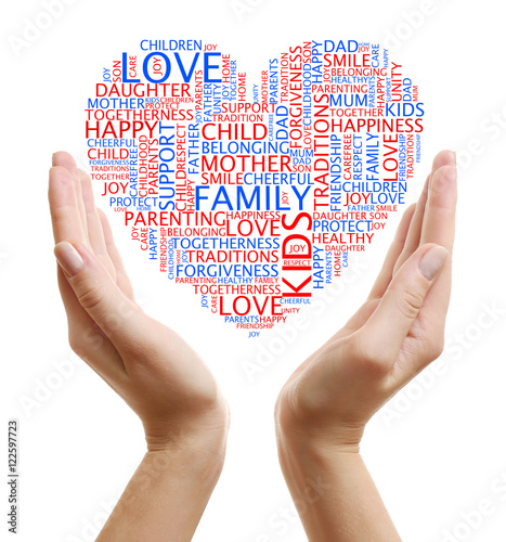 Female hands holding heart shaped word cloud on white background. Family concept.