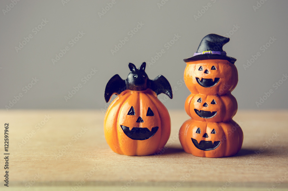Happy Halloween, Two Pumpkin on table wood with gray wall background, halloween concept. Copy space. retro effect. Happy Halloween, Two Pumpkin on table wood with gray wall background, halloween concept. Copy space. retro effect.