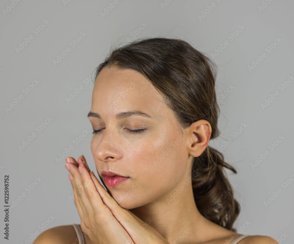 Beautiful girl with her hands joined Beautiful girl with her hands joined
