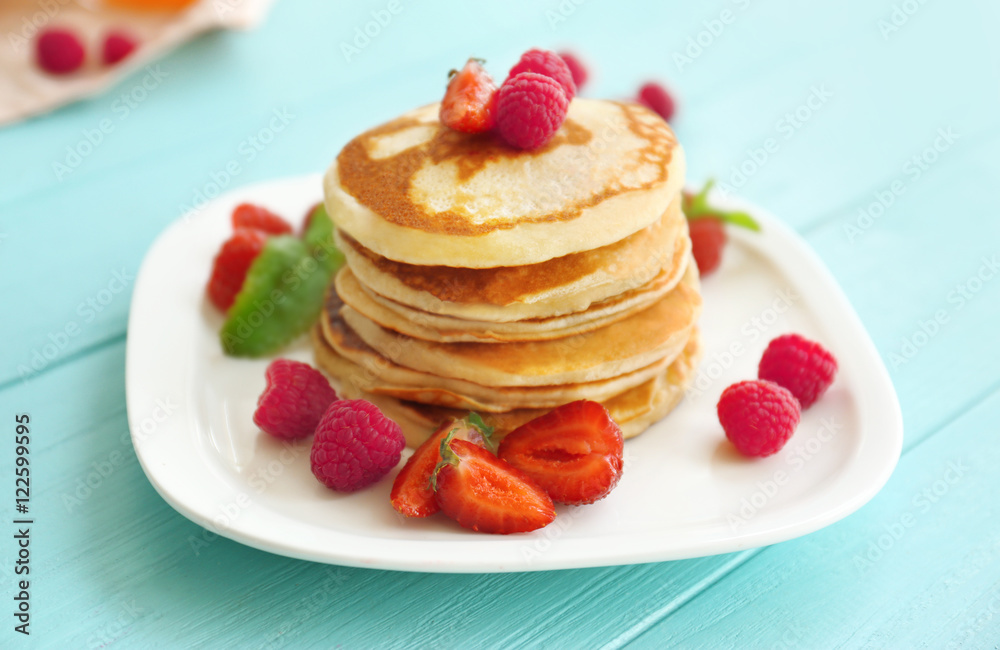 Tasty pancakes with berries on plate Tasty pancakes with berries on plate