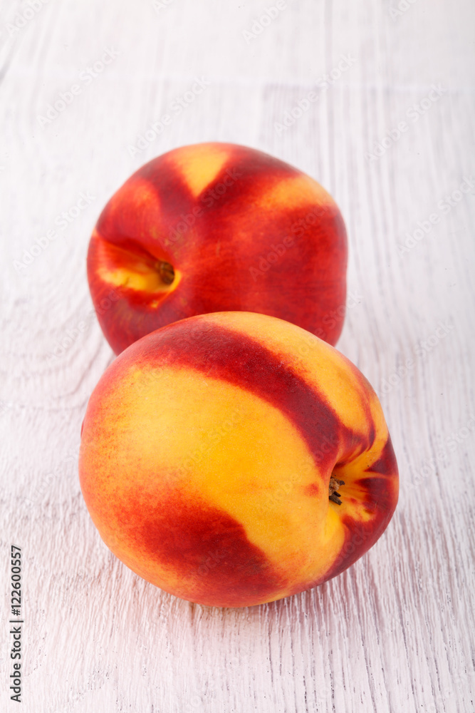 nectarines on white wooden table nectarines on white wooden table