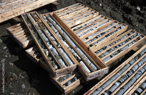 Emerald mining. Drilled mineral cores stacked in boxes, part of the process to determine productive emerald mining areas. True North Gems, Yukon Territory, Canada photo