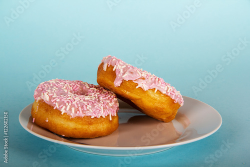 Iced doughnut on a light blue background