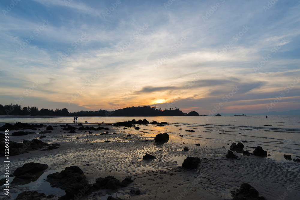 Fototapeta premium The rocky beach during sunset light, Thailand