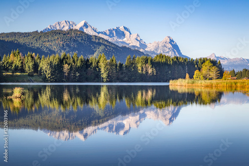 Zugspitze mountain reflecting in the silent water of lake Gerold, Bavaria, Germany