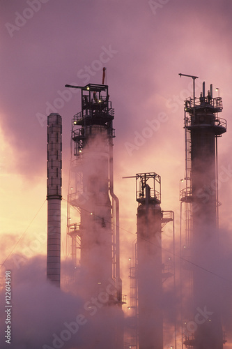 Petrochemical refinery at sunrise - Towers sillouette, British Columbia, Canada. photo