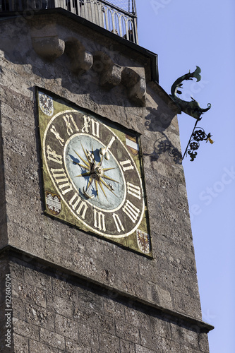 Clock of the Stadtturm a landmark watchtower built in the 1400s in Innsbruck, Austria photo