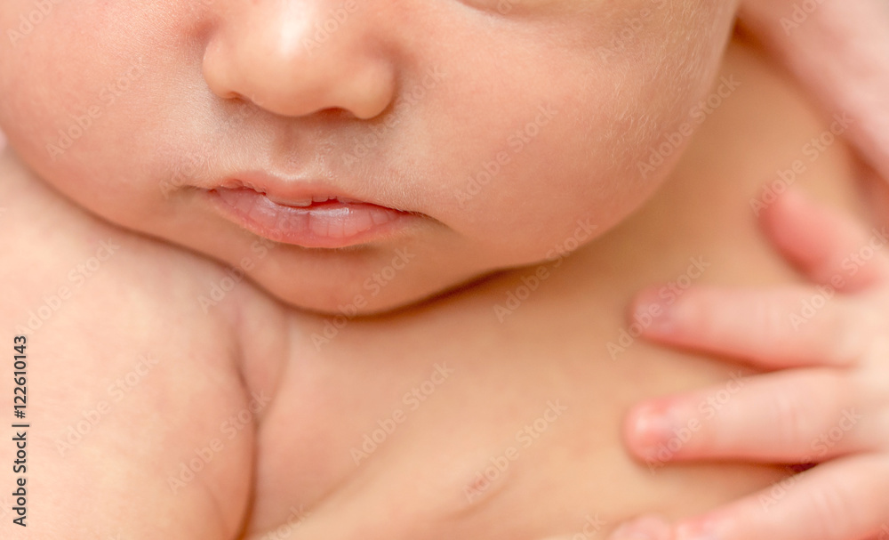 Φωτογραφία close up of face with sweet cheeks, lips and nose of a newborn baby