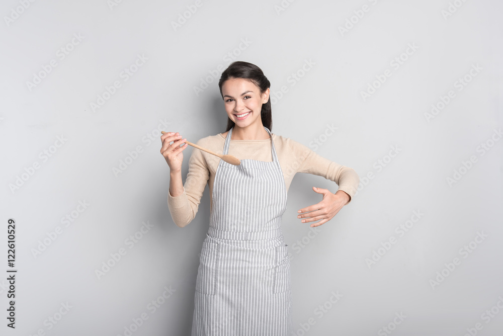 Cheerful woman cooking