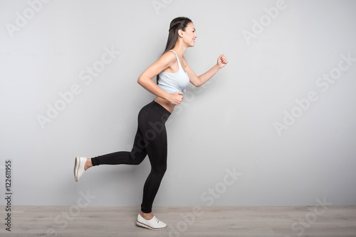 Positive slim woman running