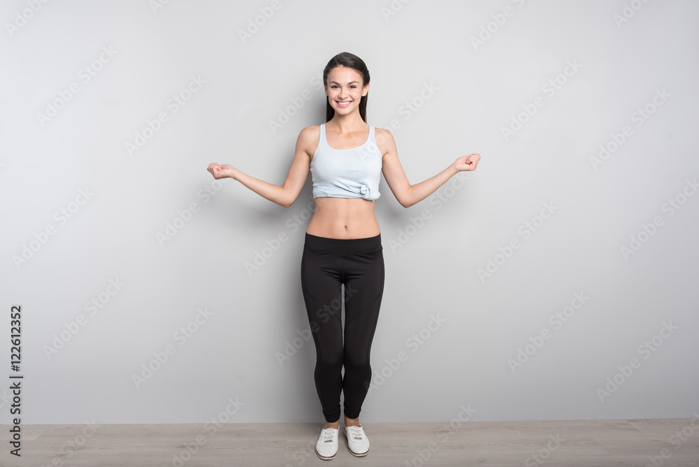 Joyful woman using jumping rope