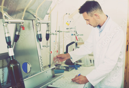 Glad man working on quality of products in lab