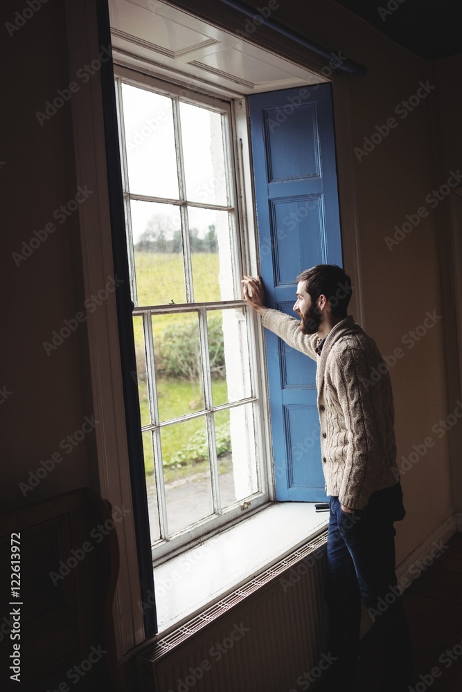 Man looking through window Man looking through window