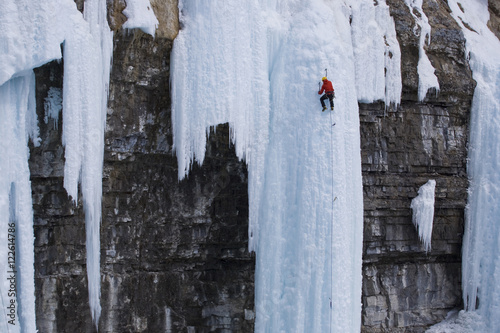 Man ice climbing, Alberta, Canada