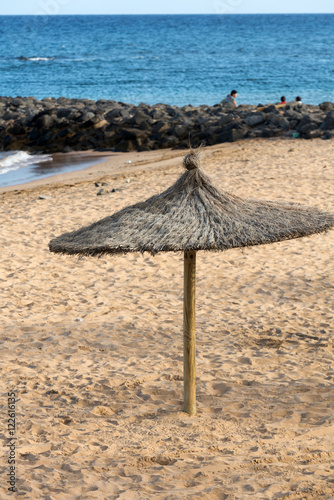 Straw umbrella on the beach