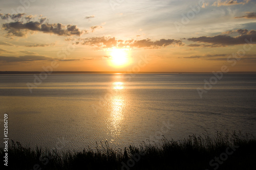 The setting sun in the Volga River