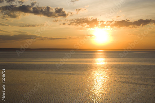 The setting sun in the Volga River