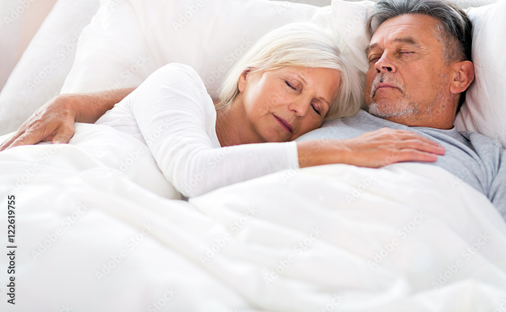 Senior couple sleeping in bed
Senior couple sleeping in bed