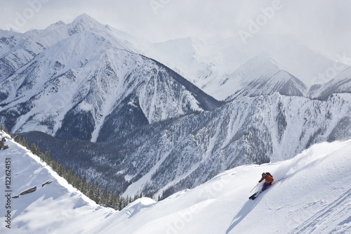 Young man skiing in Super Bowl, Kicking Horse Mountain Resort, British Columbia, Canada.