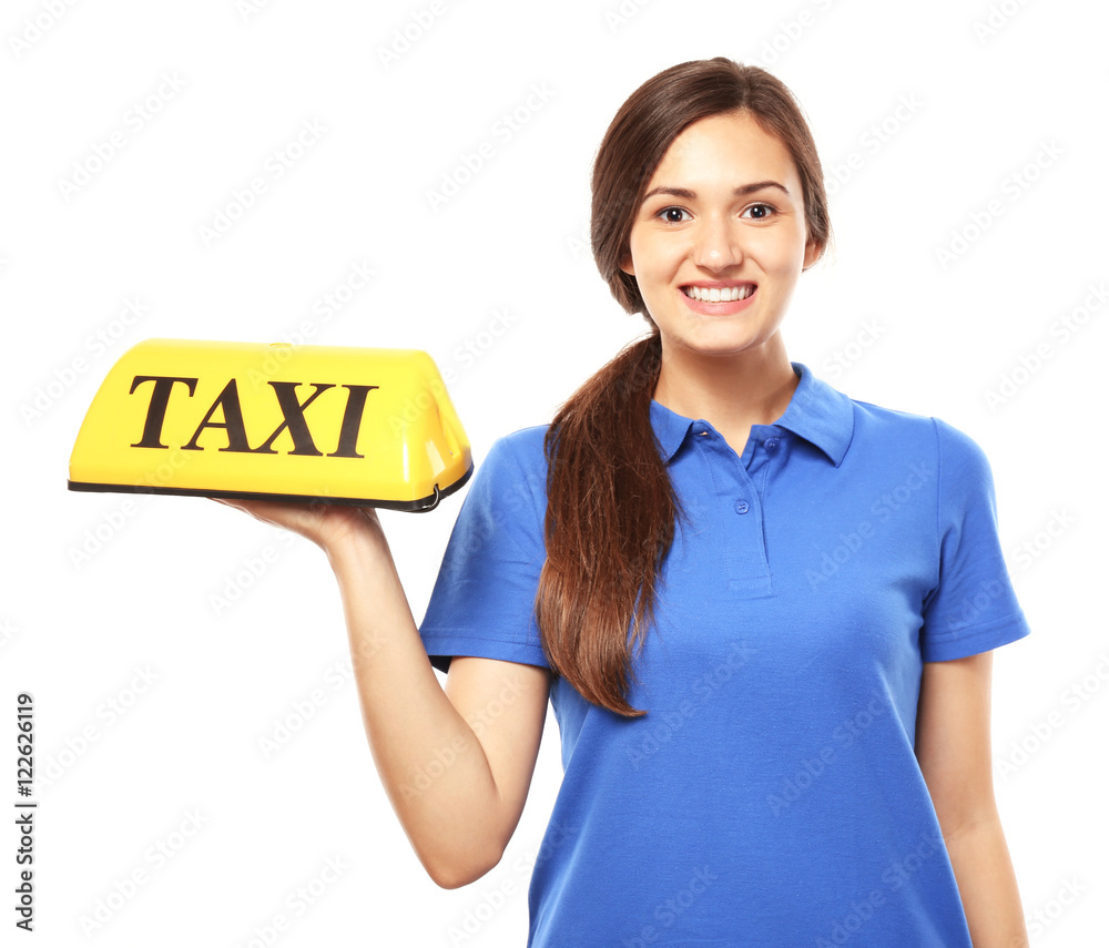 Beautiful young woman holding taxi car roof sign on white background Beautiful young woman holding taxi car roof sign on white background