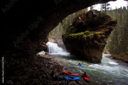 A group of male kayakers paddling Johnston Canyon, Banff National Park, AB