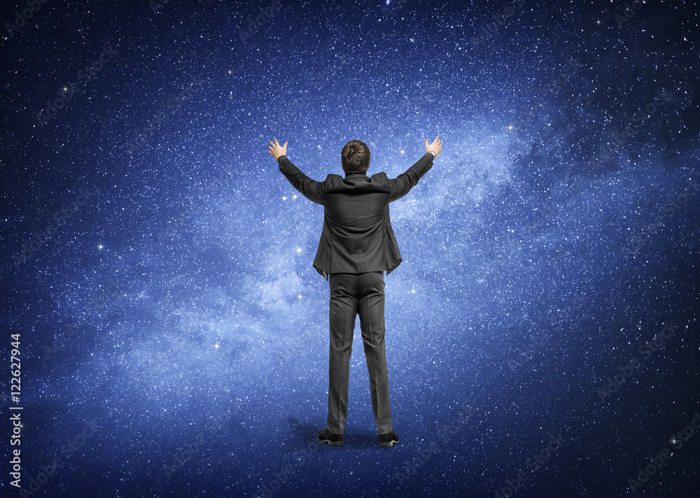 Man standing on the background of the night sky, the Milky Way galaxy. Man standing on the background of the night sky, the Milky Way galaxy.