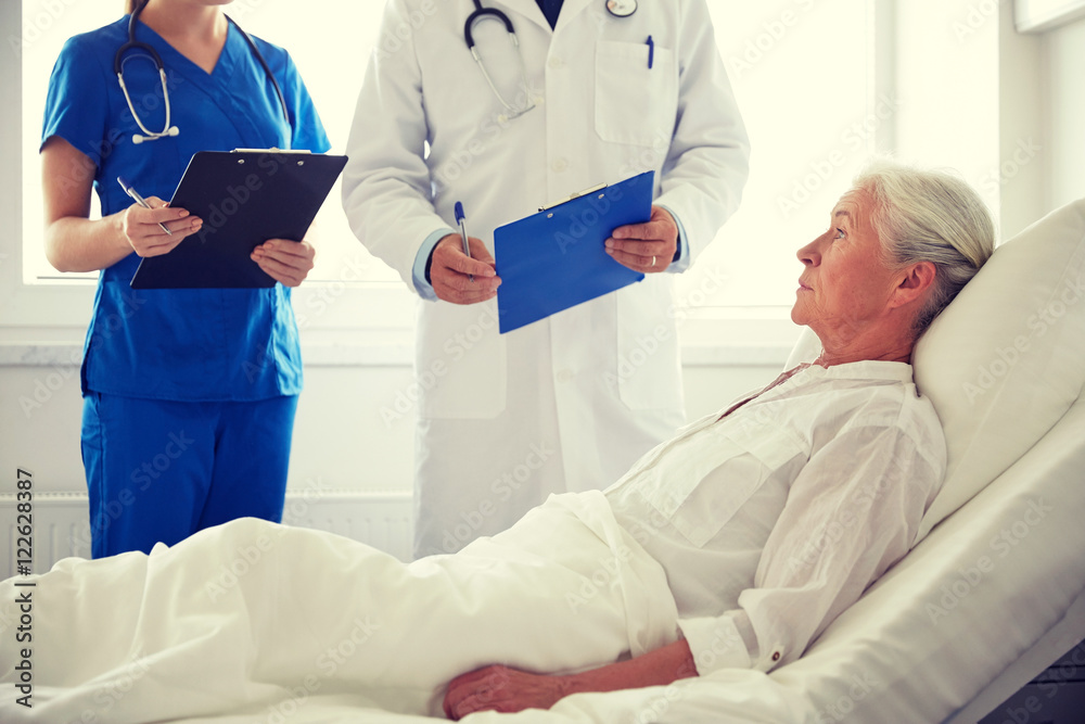 doctor and nurse visiting senior woman at hospital doctor and nurse visiting senior woman at hospital