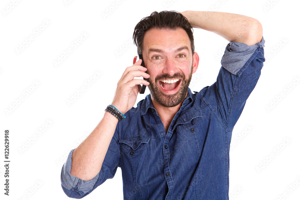 Excited mature man using on cellphone and laughing Excited mature man using on cellphone and laughing