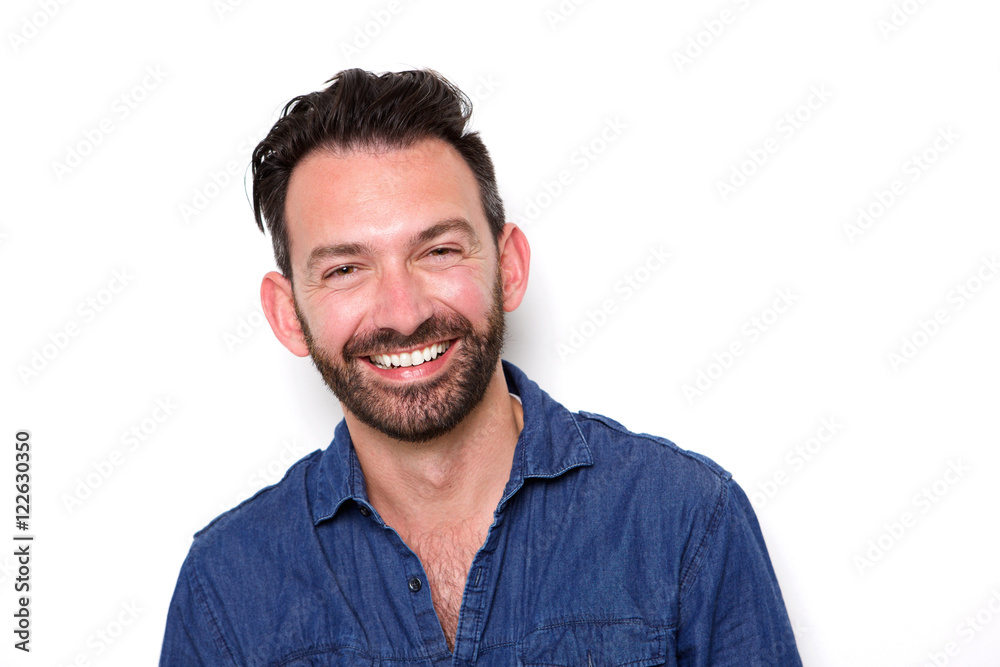 Mature man with beard smiling confidently Mature man with beard smiling confidently