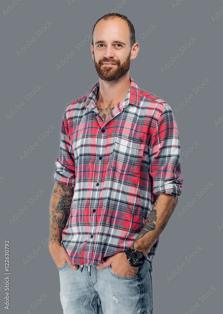 Urban bearded male isolated on grey background. Urban bearded male isolated on grey background.