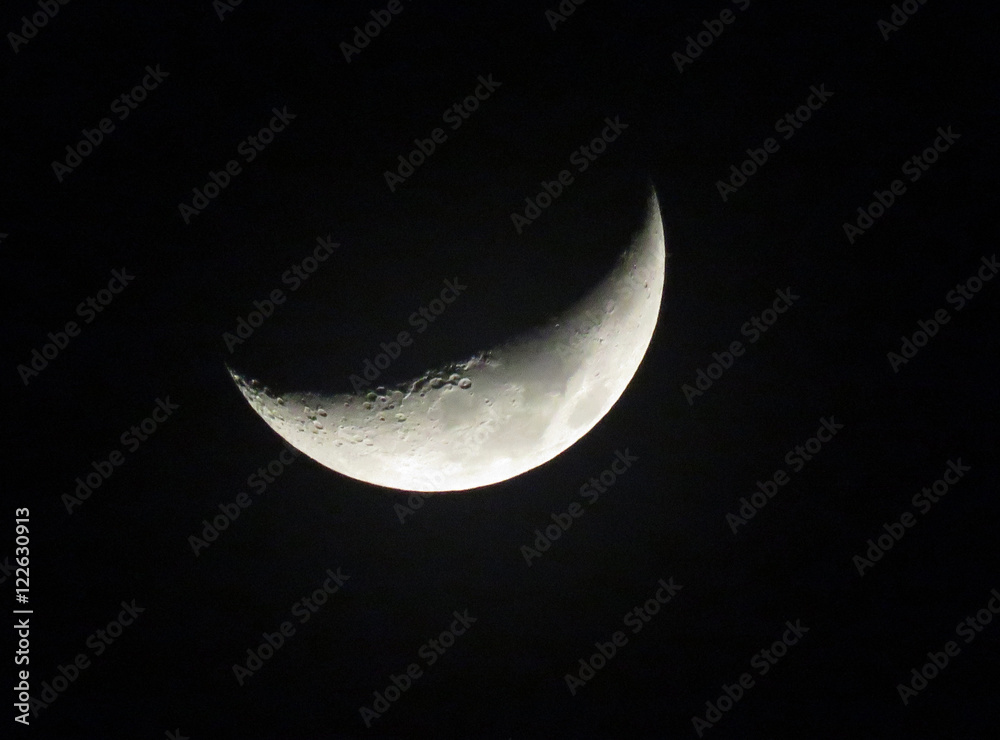 Naklejka premium Half Moon close up with black background. 