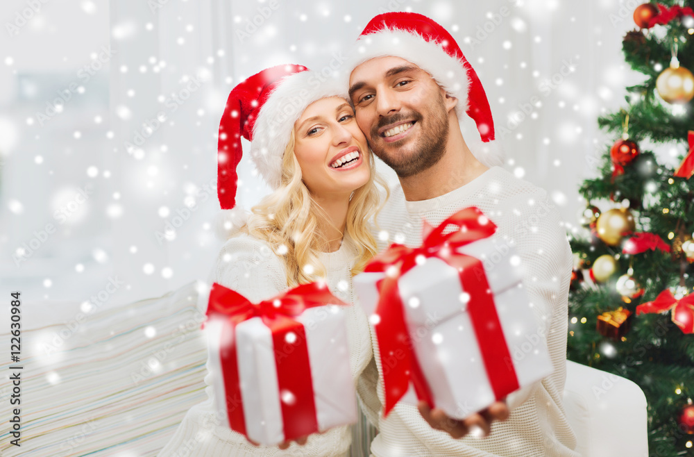 happy couple at home with christmas gift boxes happy couple at home with christmas gift boxes