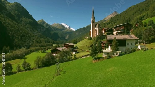 Aerial view of Heiligenblut village with its famous church of St Vincent, major landmark and tourist hotspot in the region