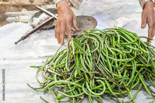 Organic local yard long beans for sale at outdoor asian marketplace