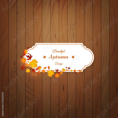 Card with leaves on wooden background. Vector autumn design.