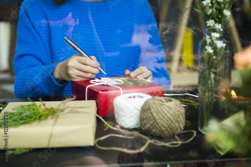 Woman preparing gifts for Christmas