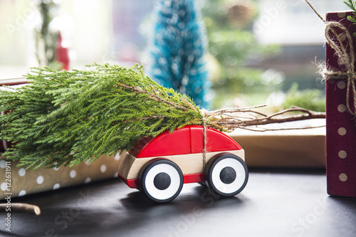 Fototapeta Naklejka Na Ścianę i Meble -  Pine on toy car for christmas.