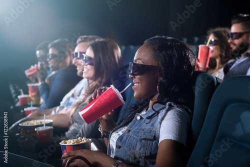 Beautiful African woman enjoying a movie