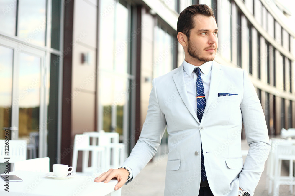 Portrait of an handsome businessman in urban setting Portrait of an handsome businessman in urban setting
