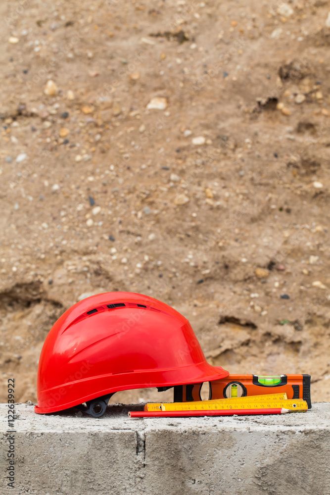 red helmet on the building construction site red helmet on the building construction site