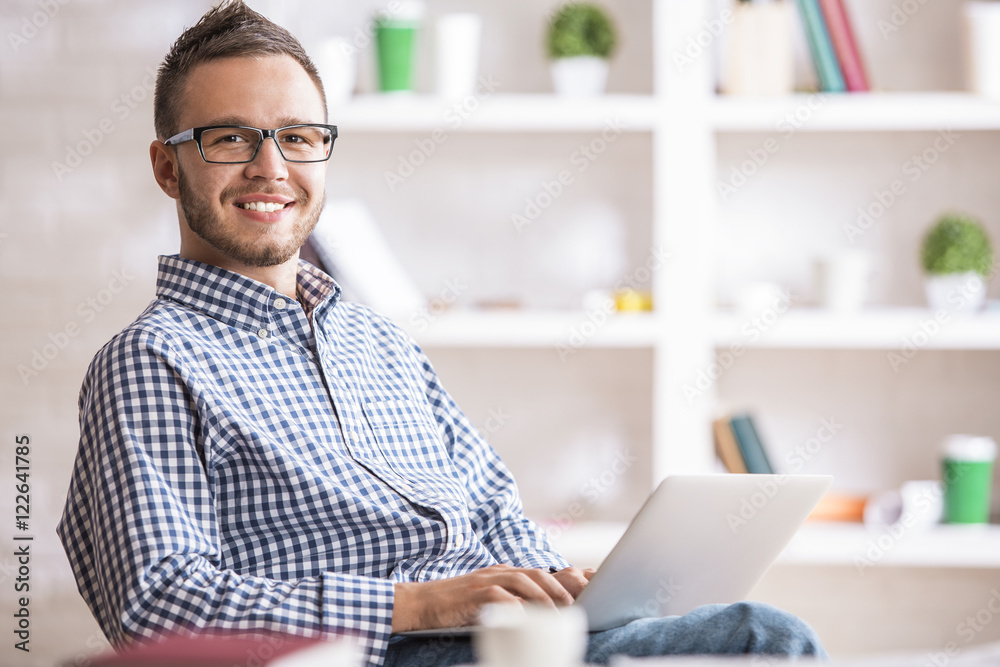 Caucasian guy using laptop Caucasian guy using laptop