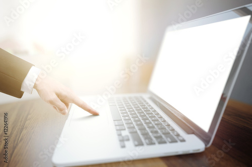 Businessman hand using laptop