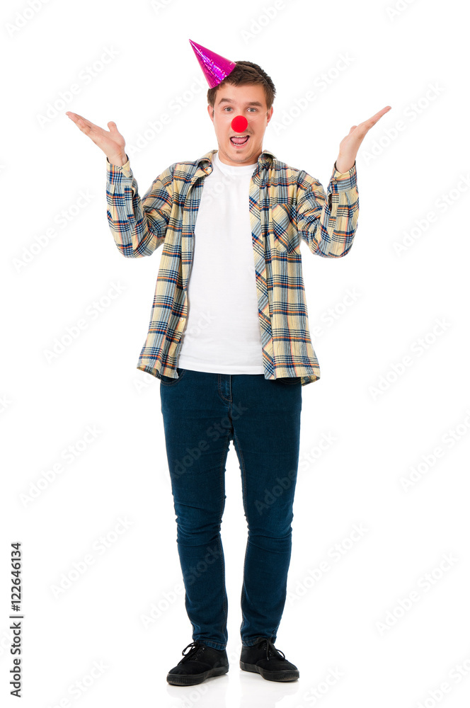 Handsome man clown isolated on white background. Teen boy with crazy look making faces and wearing red nose. Handsome man clown isolated on white background. Teen boy with crazy look making faces and wearing red nose.