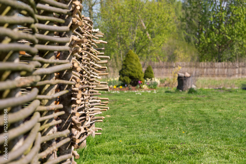 rural wicker fence in village photo