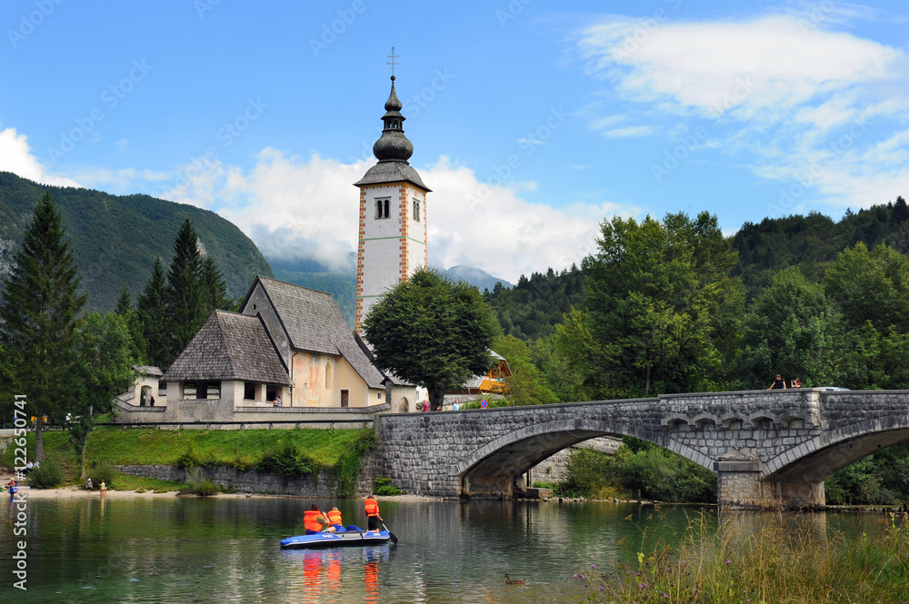 Church of St John the Baptist and stone bridge at  Bohinj Lake, Slovenia