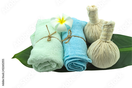 Spa herbal compressing ball , white frangipani flowers and blue faric in green leaf isolate on white background.Saved with clipping path photo